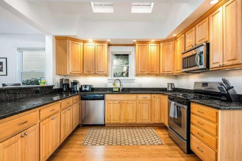 The open concept dining room and kitchen offers an abundance of space for several cooks in the kitchen and friends and family to dine. Easy access through the slider to the outdoor patio allows for additional living space.