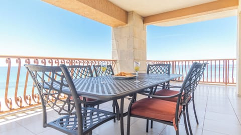 Large dining table on the balcony.