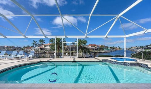 Oversized Pool with Hot Tub and Picture Window of Intersecting Canals