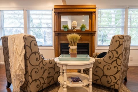 Cozy up in front of the Fireplace after a day of Shopping, Work or Play.