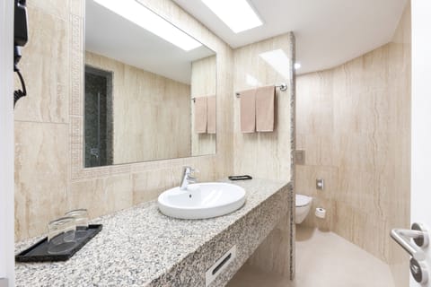 Suite, Balcony, Garden View | Bathroom | Shower, eco-friendly toiletries, hair dryer, towels