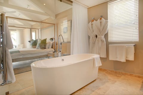 Honeymoon Suite | Bathroom | Designer toiletries, hair dryer, bathrobes, slippers