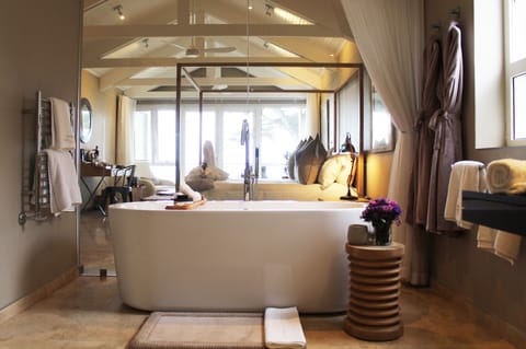 Honeymoon Suite | Bathroom | Designer toiletries, hair dryer, bathrobes, slippers