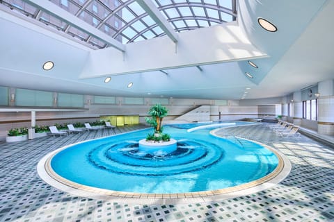 Indoor pool, open 7:00 AM to 11:00 PM, sun loungers, lifeguards on site