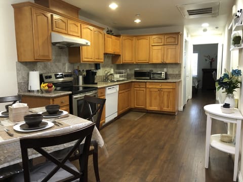 Kitchen with complete amenities as you would in your house & dinner table for 4