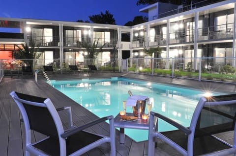 Outdoor pool, open 6:00 PM to 9:00 PM, pool umbrellas, sun loungers