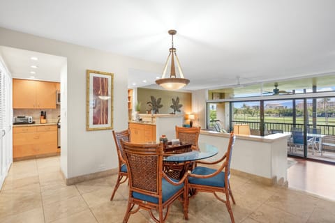 Spacious dining area with views of kitchen and step down family room (2 steps).