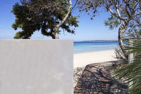 Direct access to the beach through a private small gate