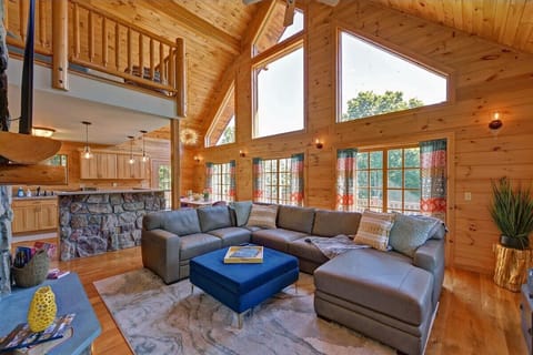 Recharge with family and friends, this relaxing lounging area features leather couch that seats up to 10-12, a gas fireplace, and a 65 inch UHD smart TV.
