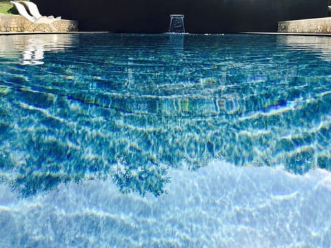 Seasonal outdoor pool, open 7:00 AM to 11:00 PM, sun loungers