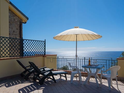 Property, Furniture, Sky, Sea, Umbrella, Building, Table, Vacation, Room, Ocean