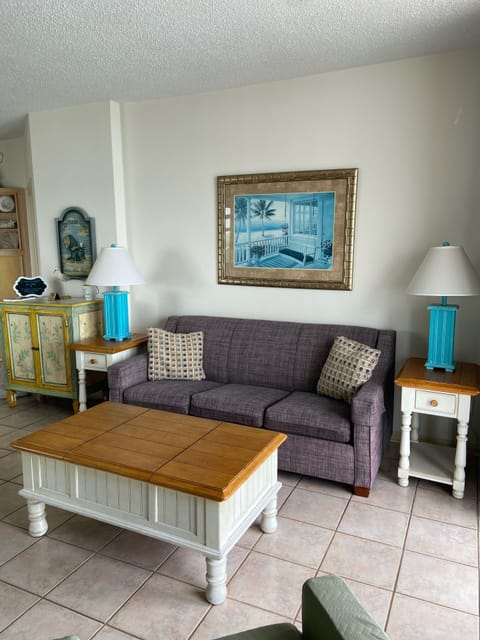Living room with open floor plan, ocean views & balcony access