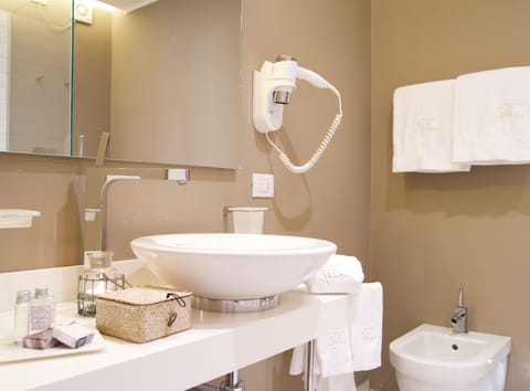 Shower, rainfall showerhead, designer toiletries, hair dryer