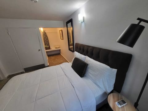 Full bed . Bedroom with air conditioner .