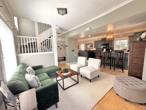 Enter into the first living room open to the kitchen.