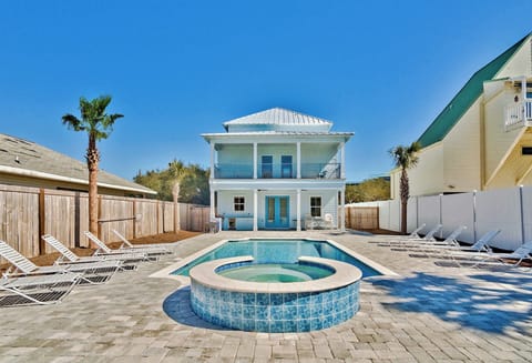 Courtyard-style spa set beside the home for easy outdoor soaking.