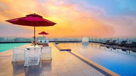 Outdoor pool, open 8:00 AM to 9:00 AM, pool umbrellas, sun loungers