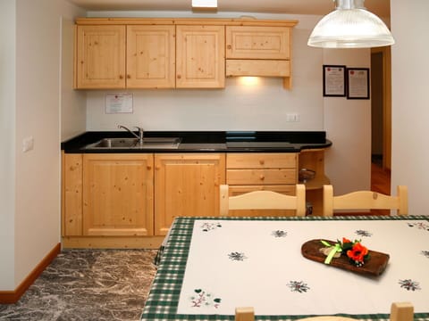 Cabinetry, Furniture, Countertop, Property, Kitchen Sink, Wood, Drawer, Kitchen Stove, Kitchen, Lighting