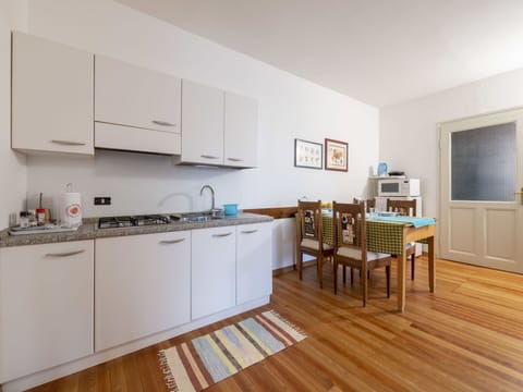 Cabinetry, Countertop, Kitchen, Kitchen Appliance, Wood, Kitchen Stove, Sink, Flooring, Floor, Window