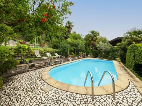 Water, Plant, Sky, Swimming Pool, Building, Tree, Chair, Azure, Shade, Outdoor Furniture