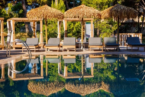 Indoor pool, 3 outdoor pools, open 10:00 AM to 7:00 PM, pool umbrellas