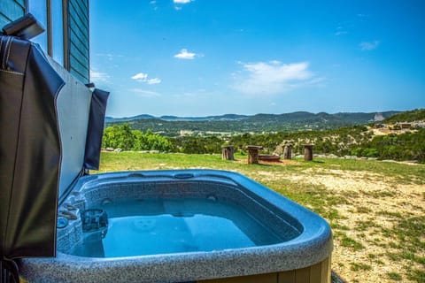 Not only is there a warm and soothing hot tub here, but it's got one of the most amazing views in the Hill Country!