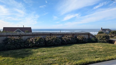 grassy area in front of deck just partially fenced