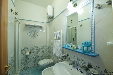 Double Room, Balcony, Partial Sea View | Bathroom | Shower, rainfall showerhead, free toiletries, hair dryer