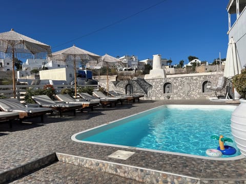 Seasonal outdoor pool, open 9:00 AM to 9:00 PM, pool umbrellas