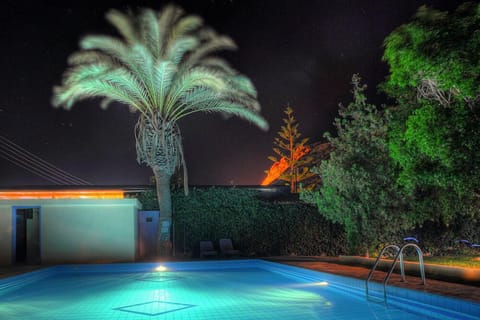 Seasonal outdoor pool, open 8:30 AM to 8 PM, pool umbrellas