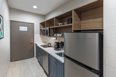 Hypo-allergenic bedding, desk, laptop workspace, blackout drapes