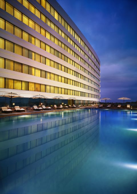 Outdoor pool, open 6:00 AM to 8:00 PM, pool umbrellas, sun loungers