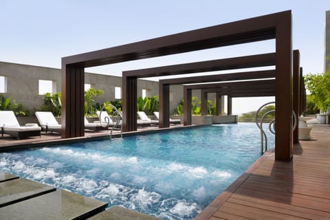 Outdoor pool, open 7:00 AM to 8:00 PM, free cabanas, pool umbrellas