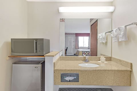 Desk, laptop workspace, iron/ironing board, free cribs/infant beds