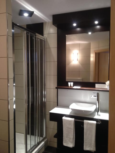 Shower, free toiletries, hair dryer, towels