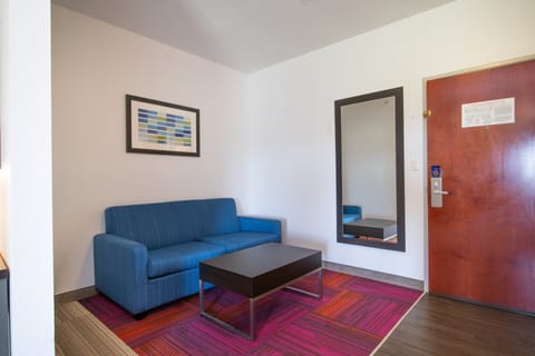 Suite, 1 King Bed with Sofa bed | Desk, blackout drapes, iron/ironing board, free cribs/infant beds