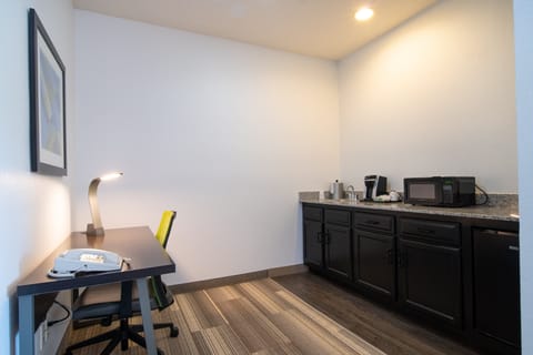 Desk, blackout drapes, iron/ironing board, free cribs/infant beds