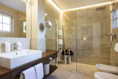 Comfort Room | Bathroom | Designer toiletries, hair dryer, bathrobes, slippers