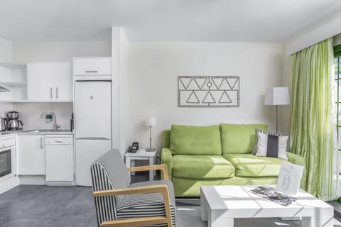 Apartment, 1 Bedroom | Living area | 28-inch flat-screen TV with digital channels, TV