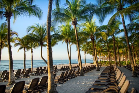 On the beach, white sand, free beach cabanas, sun loungers