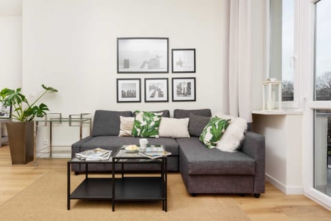 The living room's modern and stylish decor creates a welcoming atmosphere. 