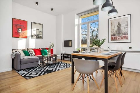 Relax in the stylish living room with a comfortable sofa and modern decor.