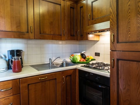 Countertop, Cabinetry, Room, Kitchen, Furniture, Property, Lighting, Interior Design, Wood Stain, Kitchen Stove