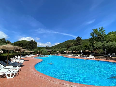 Water, Sky, Cloud, Swimming Pool, Azure, Tree, Plant, Outdoor Furniture, Natural Landscape, Coastal And Oceanic Landforms