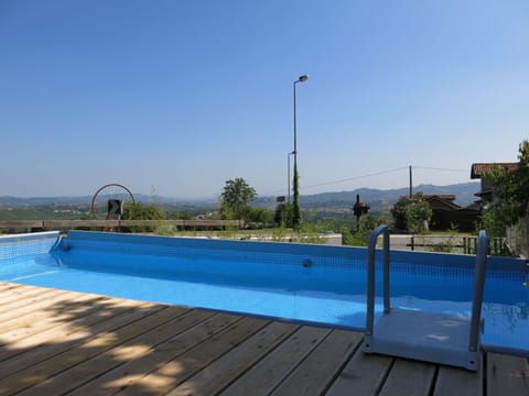 Water, Sky, Plant, Street Light, Swimming Pool, Azure, Shade, Tree, Outdoor Furniture, Rectangle