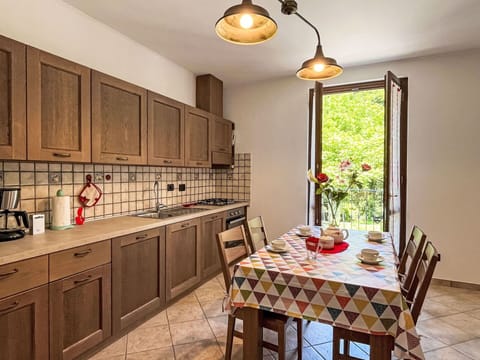 Cabinetry, Furniture, Property, Countertop, Table, Wood, Interior Design, Chair, Lighting, Kitchen