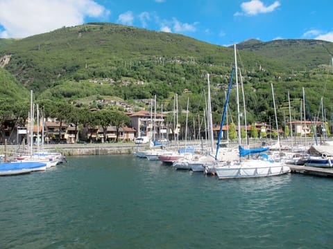 Water, Boat, Sky, Cloud, Mountain, Azure, Watercraft, Coastal And Oceanic Landforms, Lake, Vehicle