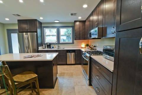Sink overlooks garden with fruit trees