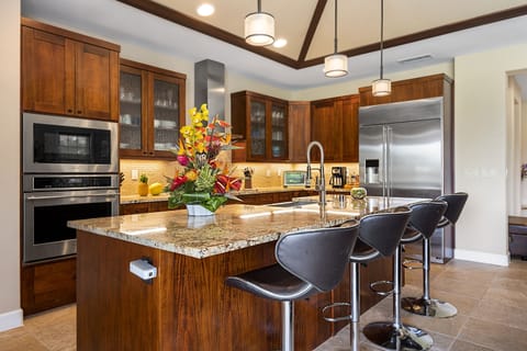 The gourmet kitchen offers everything you need to cook and connect—featuring granite counters and top-tier appliances.