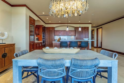 Lanai dining meets open kitchen and indoor dining space
